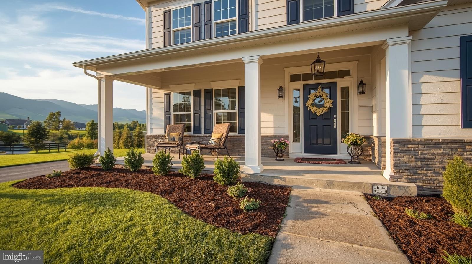 Professional Realtor reviewing home selling documents with homeowners in front of a well-maintained property in Winchester, VA with mountain views.